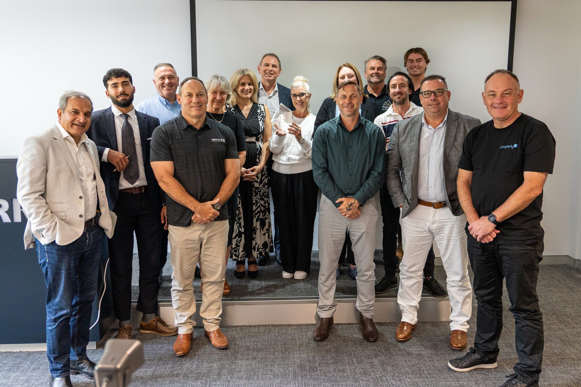 A partner network team together at an event